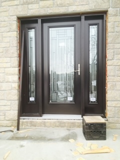 A door with two side panels and one glass panel.