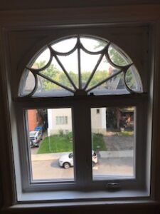 A casement window with a dome top