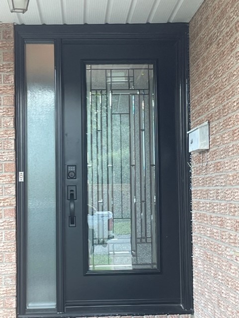 A door with a glass window and a metal frame.
