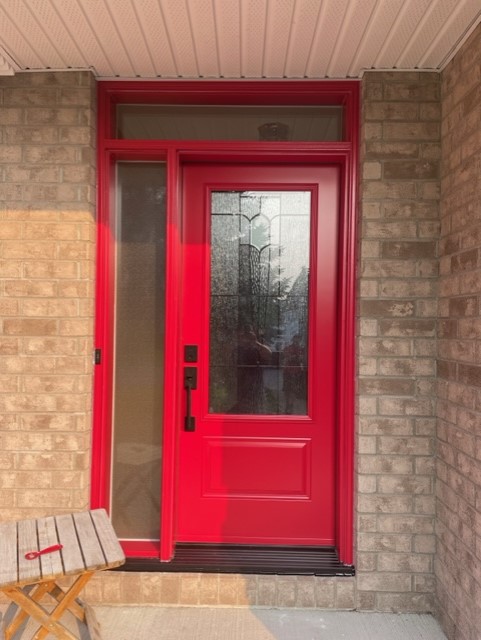 A red color door with glass windows